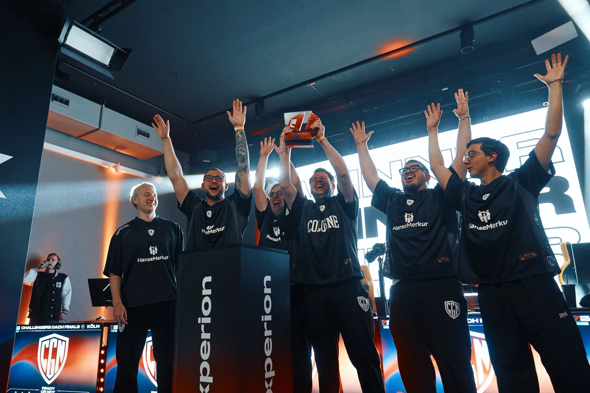 CGN Esports players on stage at a live tournament