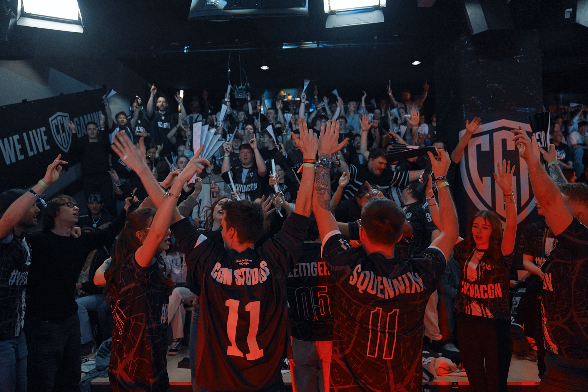 CGN Esports fans with arms raised celebrating at XPERION Cologne